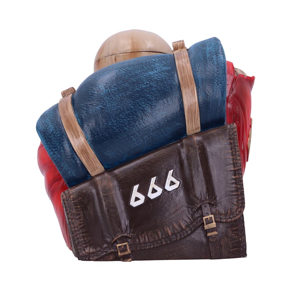A brown bag with "666" in white is strapped onto a blue and red sculpture with a helmet-like top, resembling a character's back.