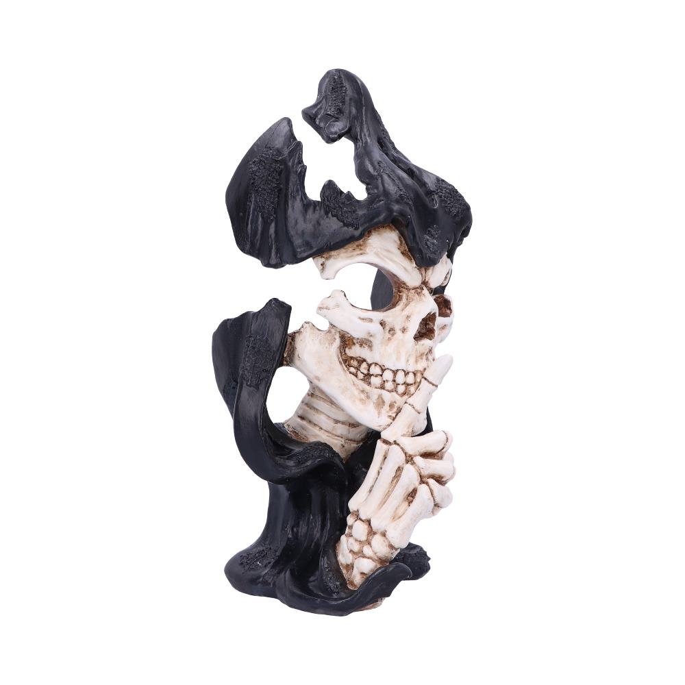 A skeletal figure in a black cloak holds a bony finger to its teeth, signaling silence. It is posed against a plain white background.