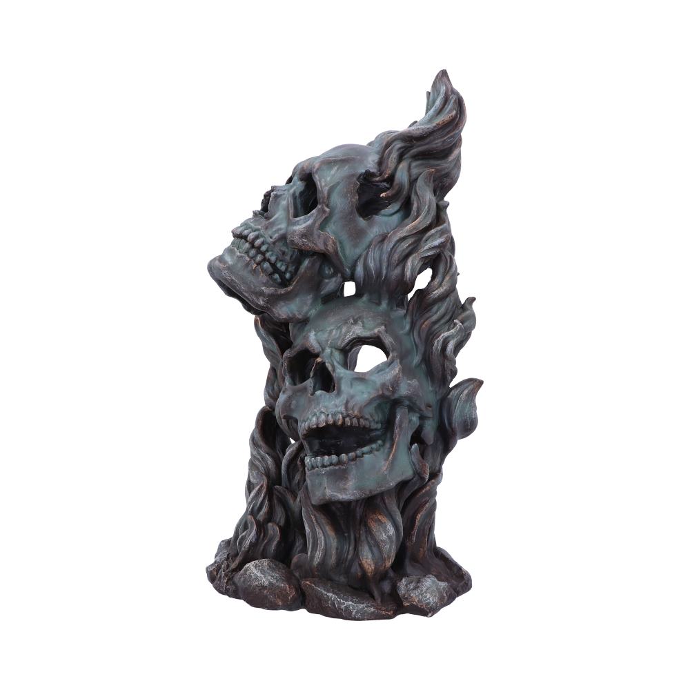 Sculpture of two intertwined skulls rising upward, resembling flames, with details emphasizing bone texture. Set against a plain white background, creating a dramatic and eerie effect.