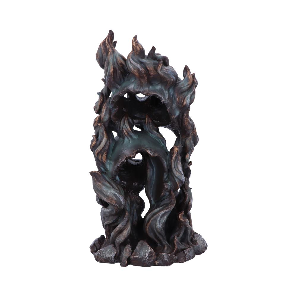 A dark, intricately designed backflow incense burner with swirling, flame-like patterns stands upon a rocky base, evoking a mystical, organic appearance suitable for home decor.