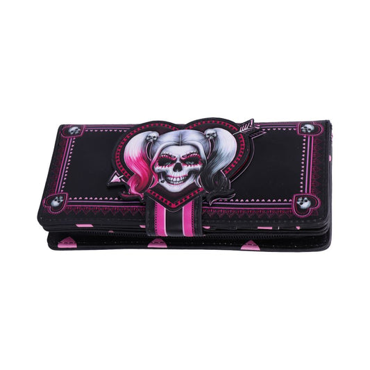 A black wallet features a skull with pink and white pigtails, set in a heart design with pink accents, surrounded by ornate patterns and small skull motifs.