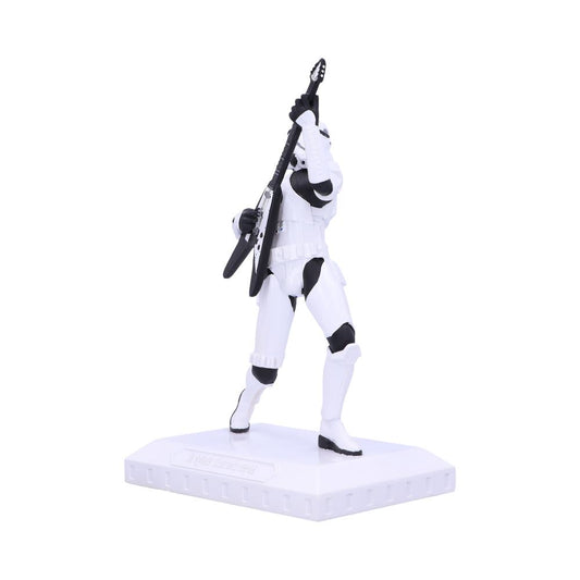 A white-armored figure holds a black guitar aloft on a white platform. The figure stands in a dynamic pose, resembling a stormtrooper, against a plain white background.
