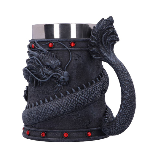 A black, stainless-steel-topped mug shows a dragon winding around its exterior. The dragon's tail forms the handle, and red jewels adorn the top and bottom rims.