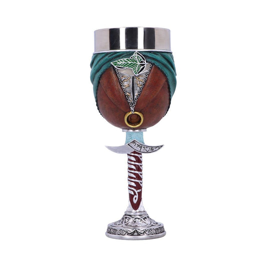 A decorative goblet shaped like a turbaned head with a sword-shaped stem, featuring intricate silver detailing and the text "Magi: Magnostadt" on a white background.