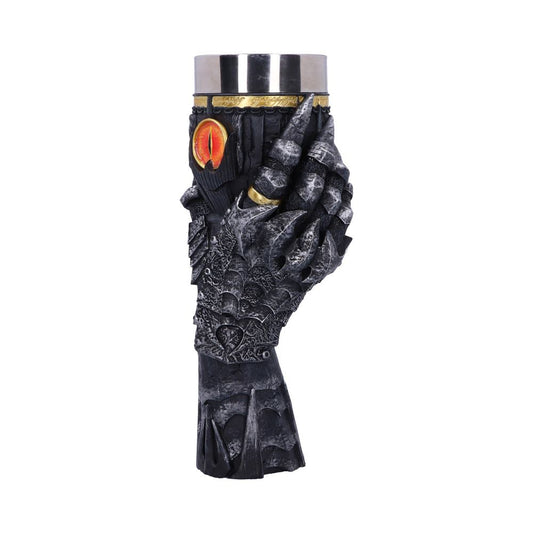A detailed, sculpted black gauntlet holds a metallic cup with gold accents and an embossed red eye, set against a plain white background.
