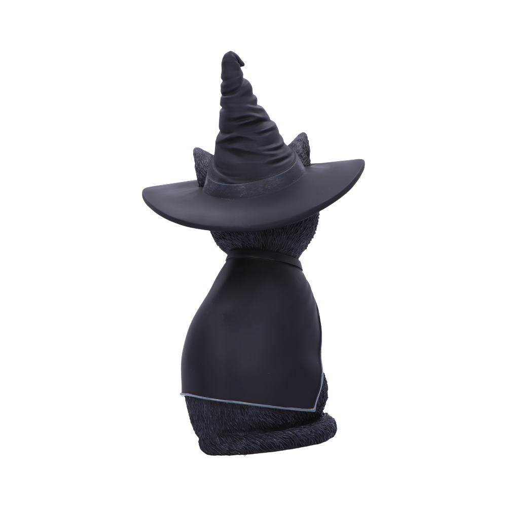 A black cat figurine wears a tall, pointed witch hat and cape, sitting upright with its back facing the viewer, isolated against a plain white background.