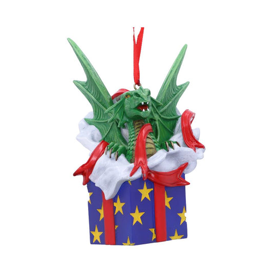 A green dragon figure emerges from a gift box adorned with stars and red ribbons, suspended by a red string. The dragon's wings are spread, and its mouth is open.