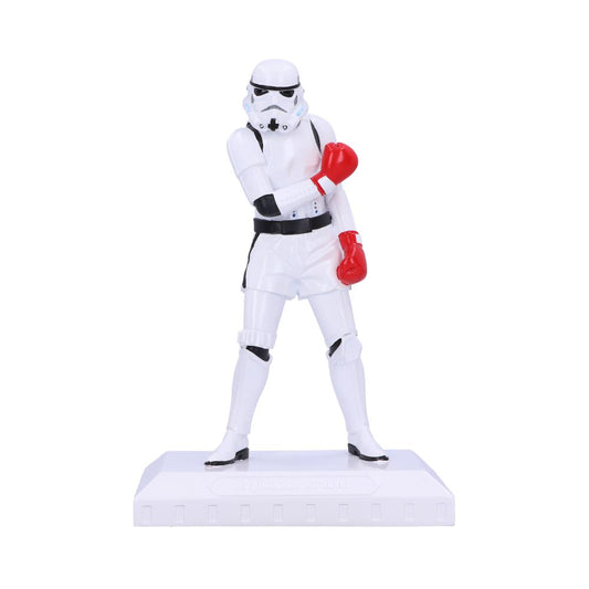 Stormtrooper figurine wearing red boxing gloves poses on a white stand, set against a plain background.