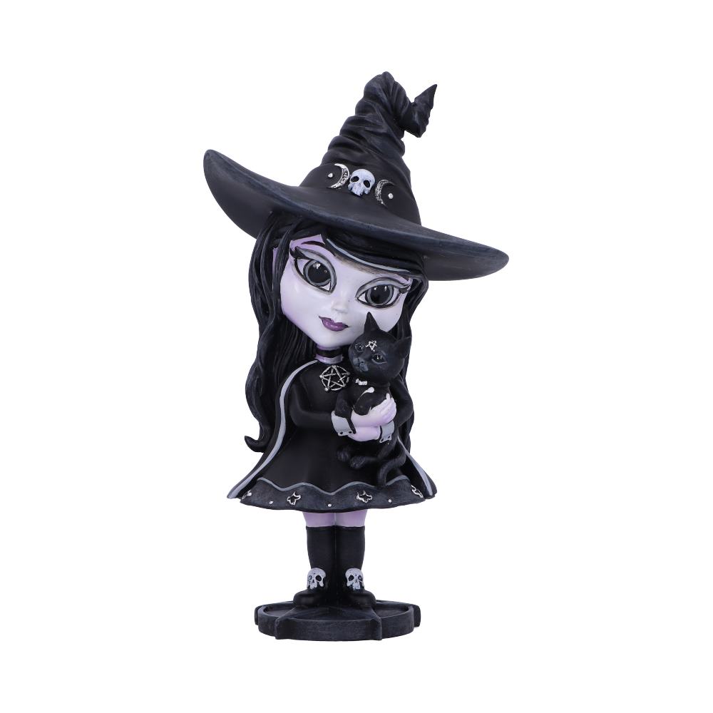A figurine depicts a wide-eyed girl wearing a large witch hat and black dress, holding a black cat in her arms, set against a plain, white background.