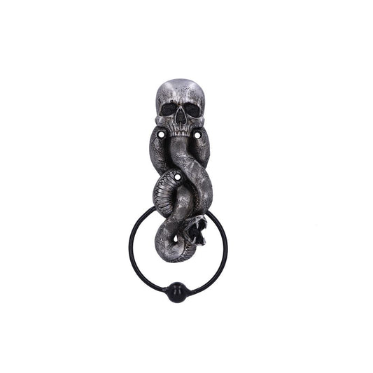 A metal door knocker features a skull intertwined with a detailed snake, with a circular handle below. The object is isolated against a plain white background.
