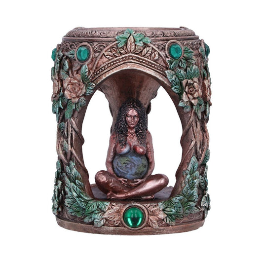A decorative sculpture features a seated, earthy woman with a globe-patterned body, surrounded by green gem accents and floral motifs, creating a natural and mystical ambiance.