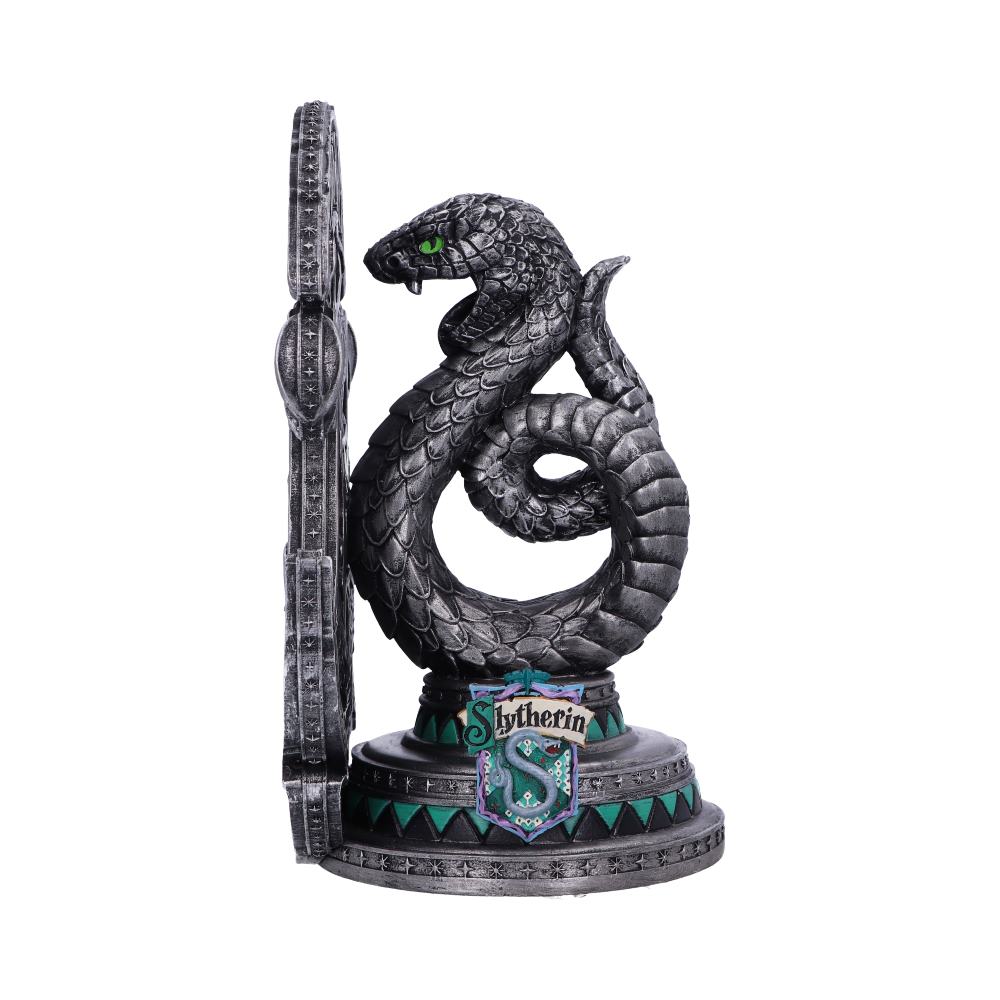 A metallic snake sculpture coils upward with an open mouth and green eyes. It displays the text "Slytherin" on a shield at the base, against a plain white background.