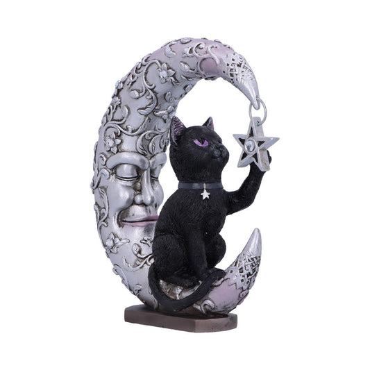 A black cat sits on an ornate crescent moon sculpture with a face, holding a star in a mystical design, placed on a small base.