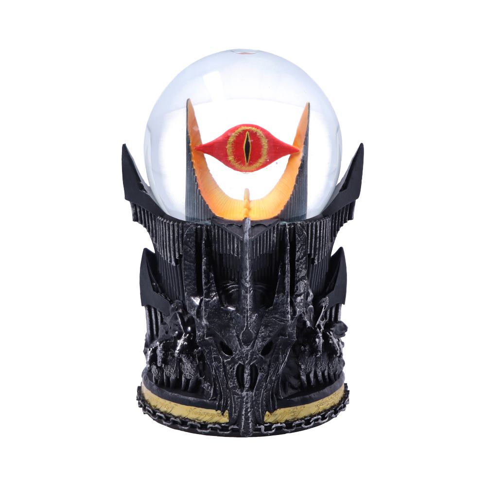 A decorative sculpture features a vivid eye within a glass orb, supported by a detailed, black spiked base resembling a fortress, suggesting a fantasy theme.