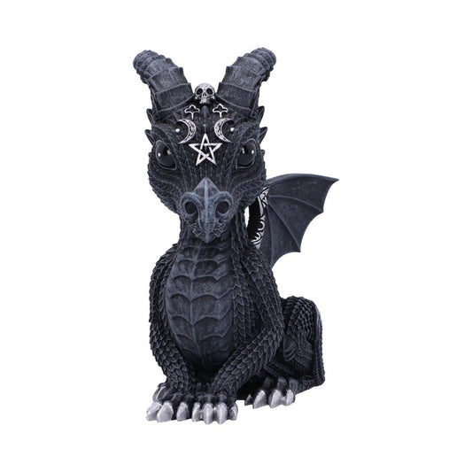 A small, dark dragon figurine sits upright, featuring ornate head decorations, including a pentagram and crescent moons, with wings slightly extended against a plain white background.