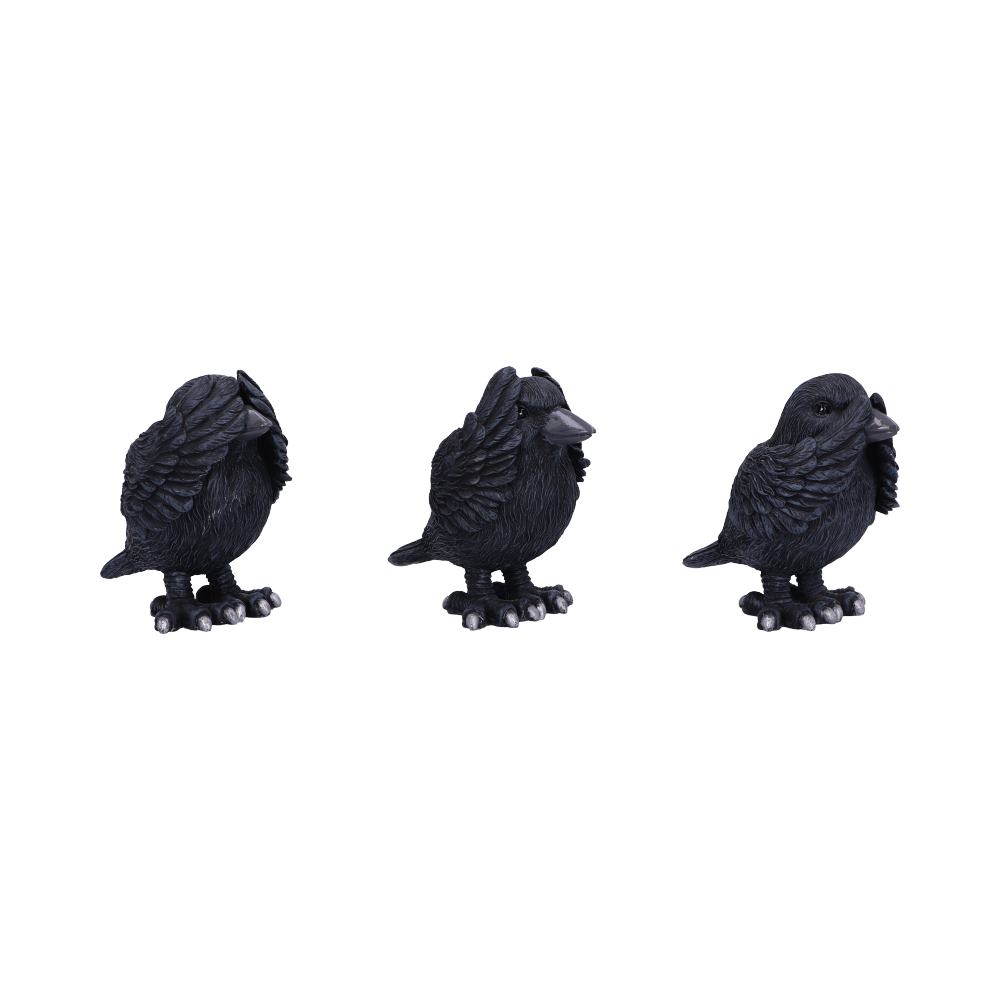 Three decorative, matte-black crow figurines stand side-by-side, facing forward, on a solid white backdrop.