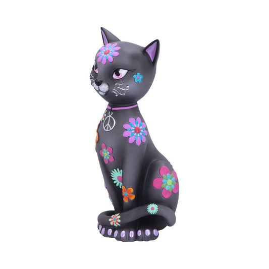 A black cat figurine sits adorned with colorful flower patterns and a peace symbol necklace, exuding a retro hippie style against a plain white background.