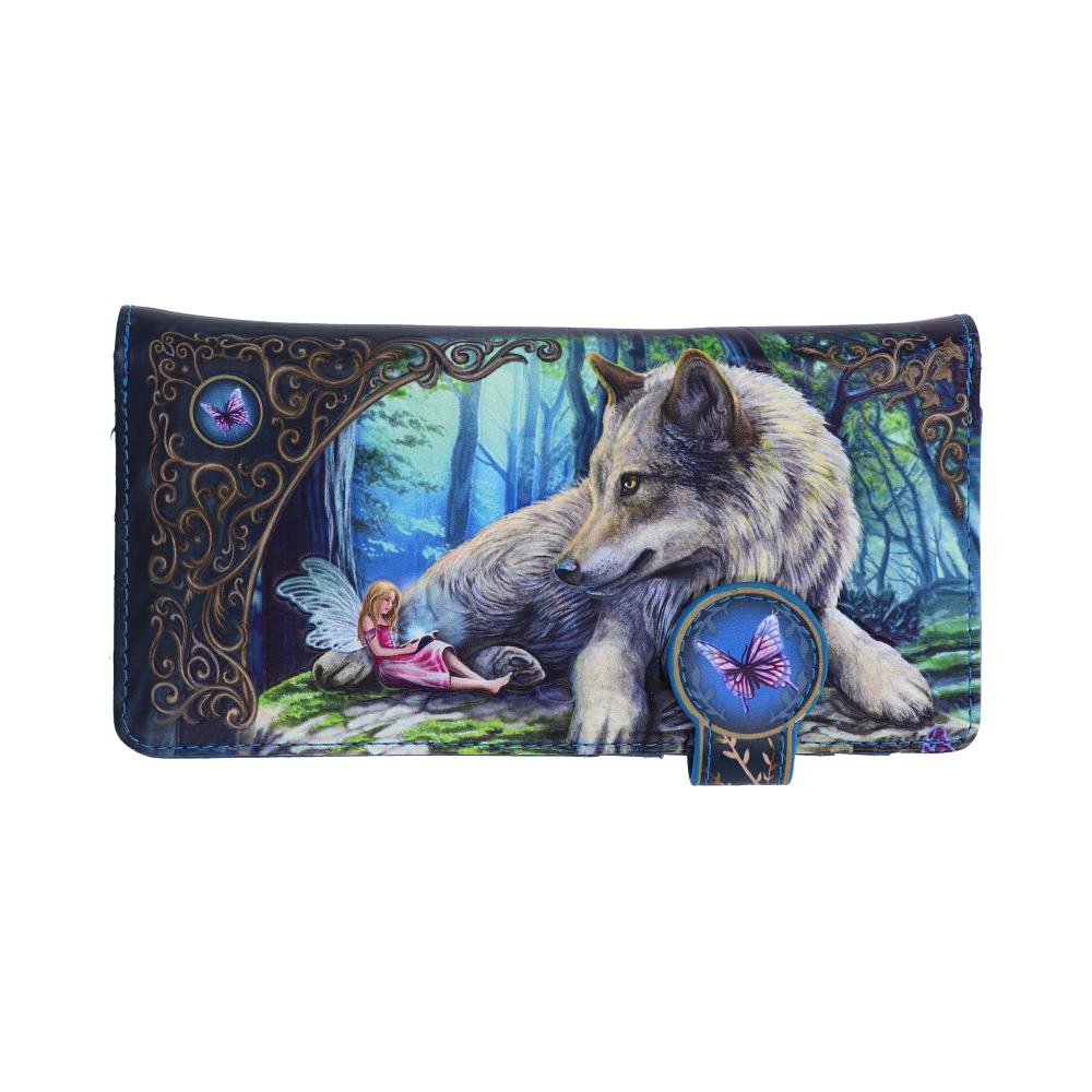 A leather wallet depicts a wolf resting near a fairy reading a book in an enchanted forest. The wallet has ornate detailing and butterfly accents.