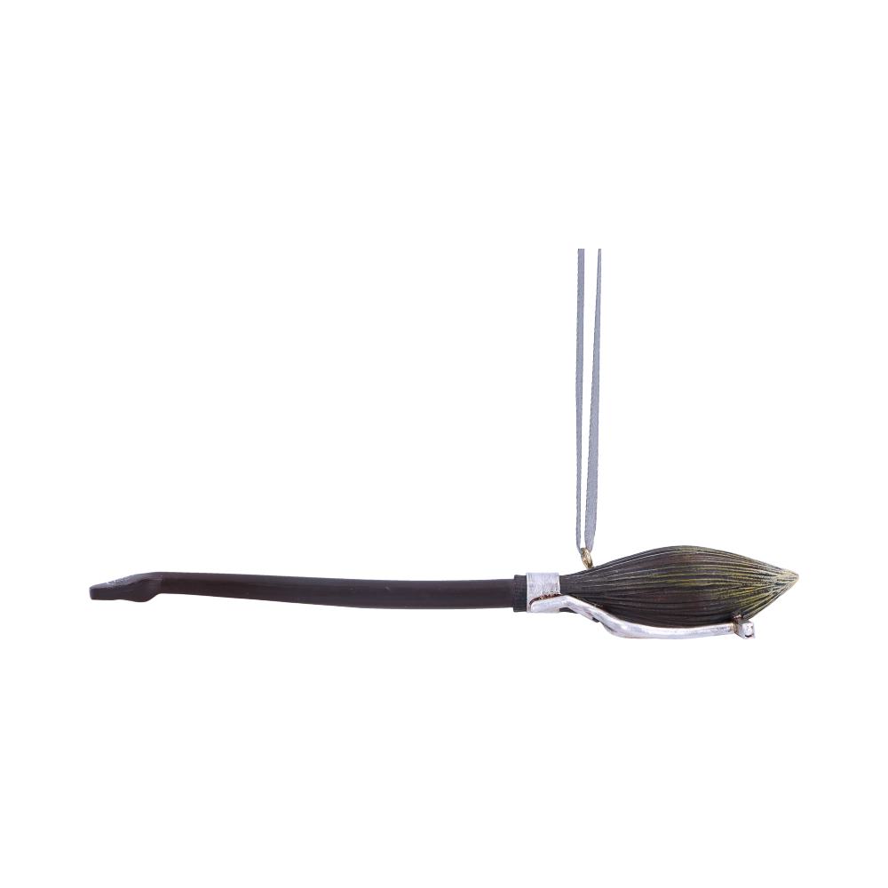 A uniquely designed dark brush pendant hangs vertically by a thin string against a plain white background. The brush has a long curved handle with a silver tip.