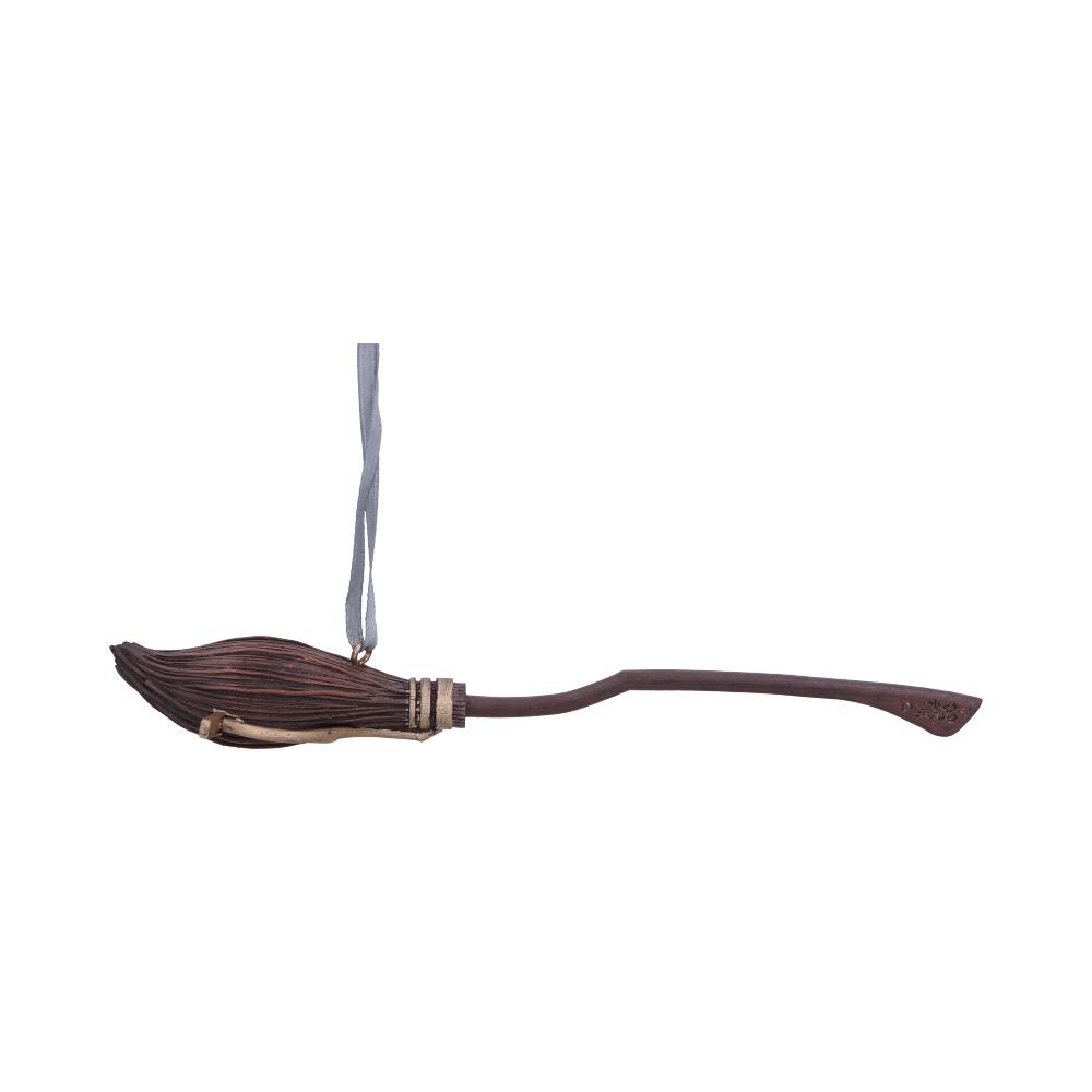 A mini wooden broomstick hangs suspended by a gray ribbon against a white background. The broom's bristles are tightly bundled, and the handle is smooth with a slightly curved design.
