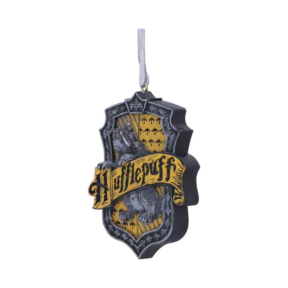 A decorative badge featuring a gray badger and a banner reading "Hufflepuff." It hangs from a ribbon, displaying yellow and black heraldic patterns with a shield-like shape in a neutral backdrop.