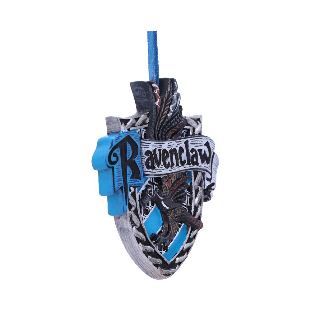 A decorative ornament features the "Ravenclaw" crest with a blue and silver shield highlighting an eagle, suspended by a blue ribbon. The background is plain white.