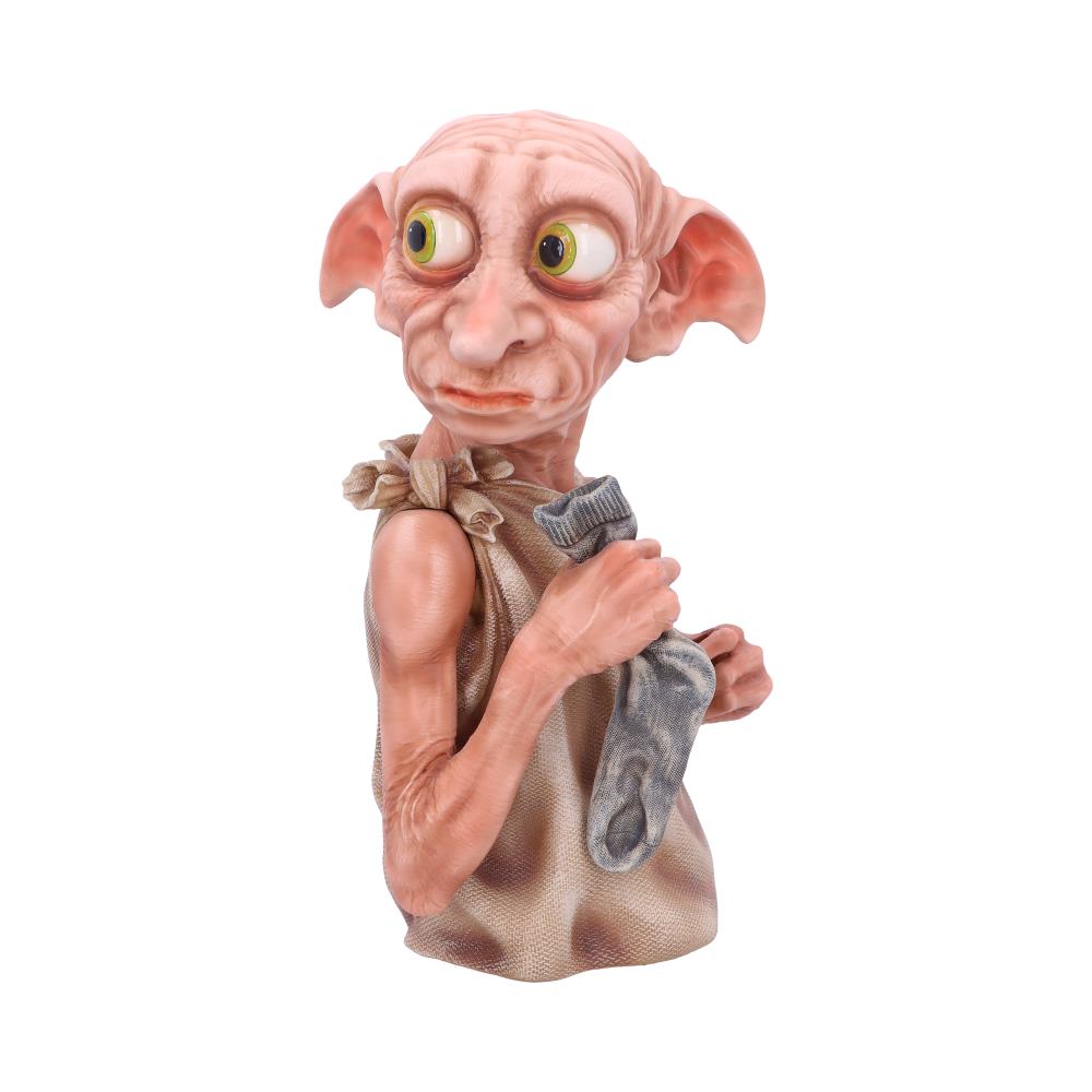 A creature with large ears and expressive eyes holds a sock, wearing a simple cloth garment. The background is plain white, focusing attention on the figure.