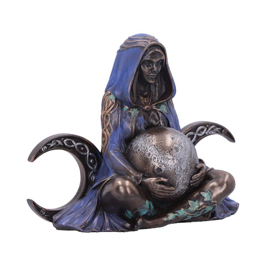 A bronze-colored figure in a blue hooded robe cradles a textured spherical object, resembling the moon, seated between crescent shapes with intricate patterns, set against a plain background.
