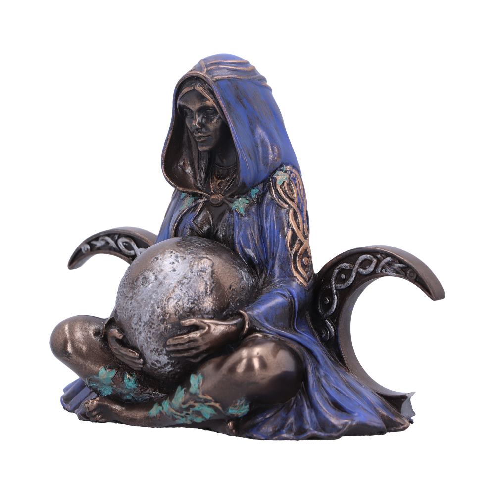 A metal statue of a seated hooded figure cradling a textured sphere, with decorative crescent moons on either side, colored in blue and bronze, evoking a mystical theme.
