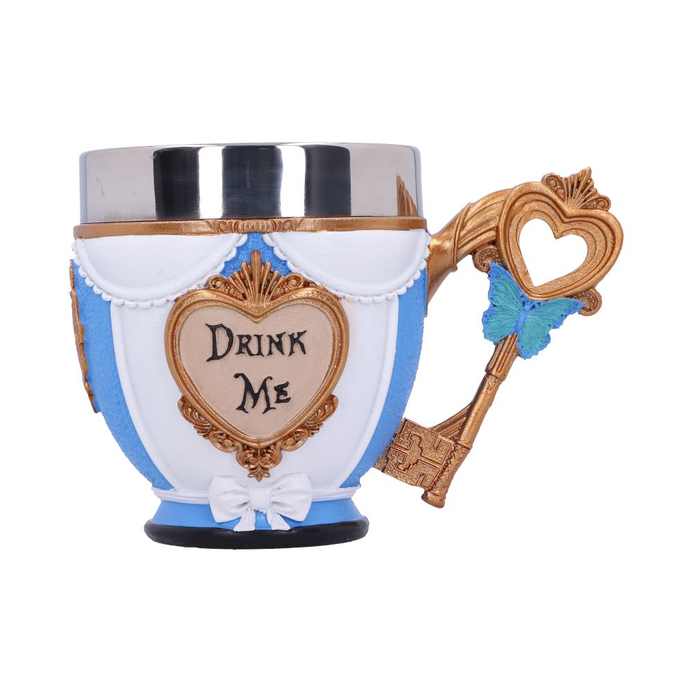 A cup displays a heart shape with "Drink Me" inscribed. It features an ornate, key-shaped handle adorned with a blue butterfly, and is set against a white background.