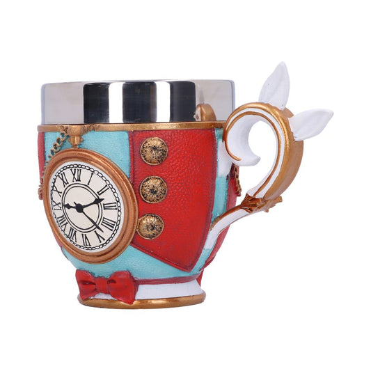 A decorative teacup features a red coat design, complete with gold buttons, a clock with Roman numerals, and a bow tie. The handle is a curly white-and-gold design with white ears. The background is a plain white.