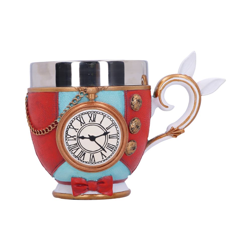 A teacup is decorated with a red and blue jacket pattern, gold buttons, a small red bow, and a white rabbit tail handle. A clock hangs over the front, set to a time between 1:30 and 1:35.