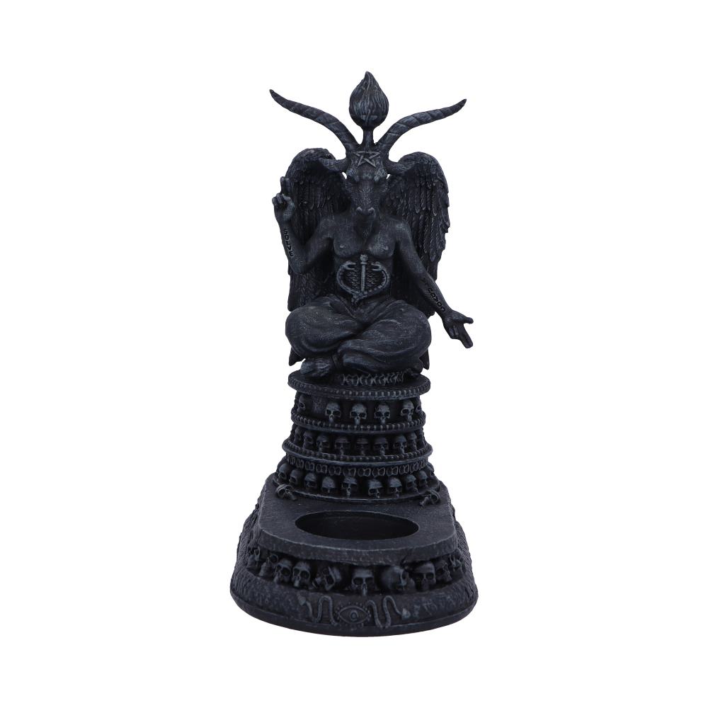 A dark-grey Baphomet statue sits cross-legged on a pedestal decorated with skulls and circular patterns, against a plain white background.