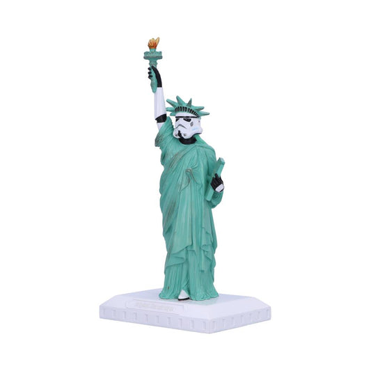 A figurine combines the Statue of Liberty and a stormtrooper helmet, holding a torch and tablet. It stands on a white base engraved with "Liberty Harmony" against a plain background.