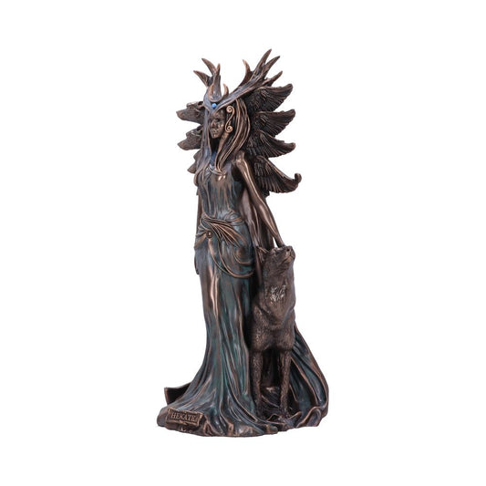 A bronze-colored statue depicts a robed female figure with a wolf by her side, adorned with a winged headdress. The name "HEKATE" is inscribed on the base.
