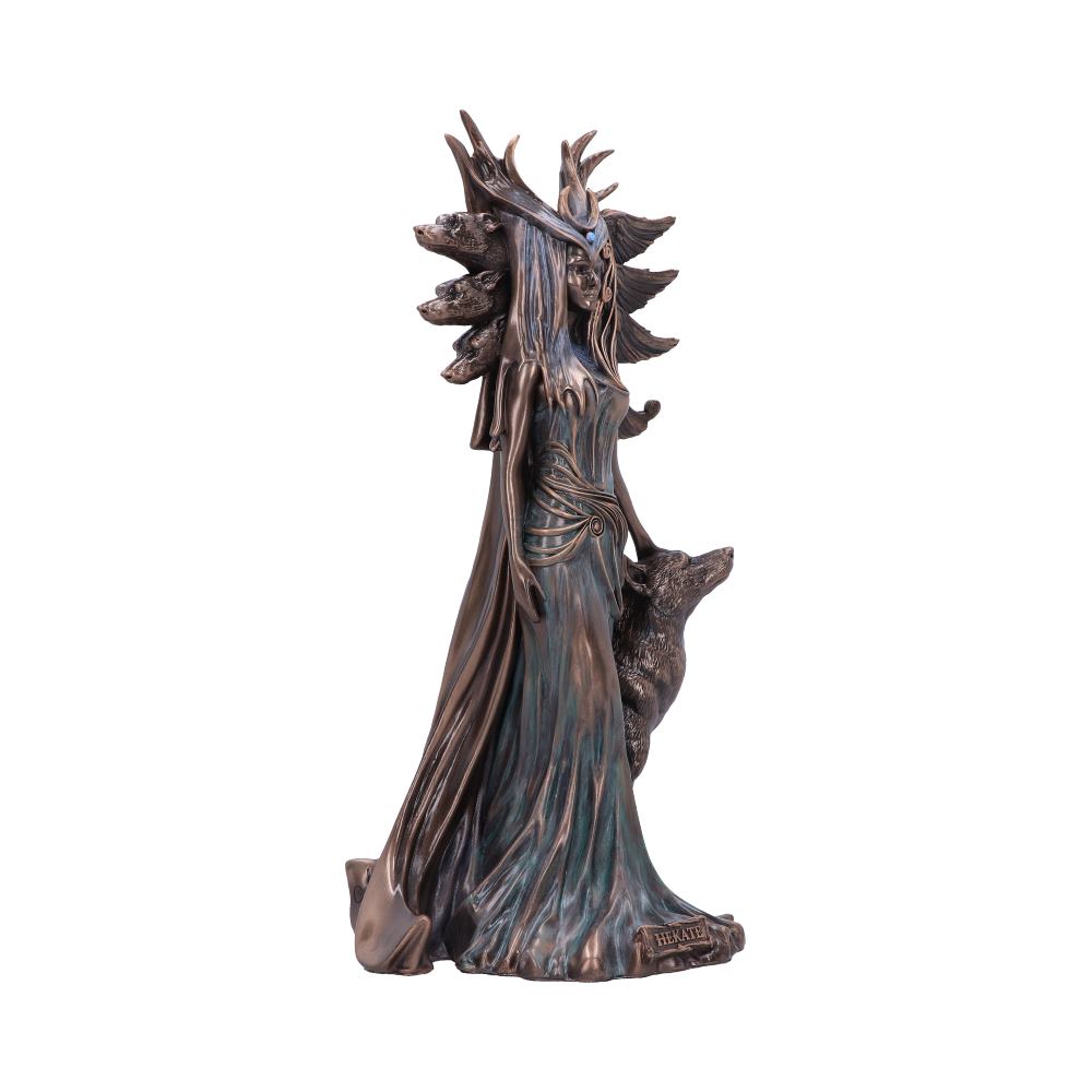 A bronze-colored statue depicts a regal figure with a spiked headdress and flowing gown, accompanied by a wolf. Text on the base reads "HEKATE." The background is plain white.