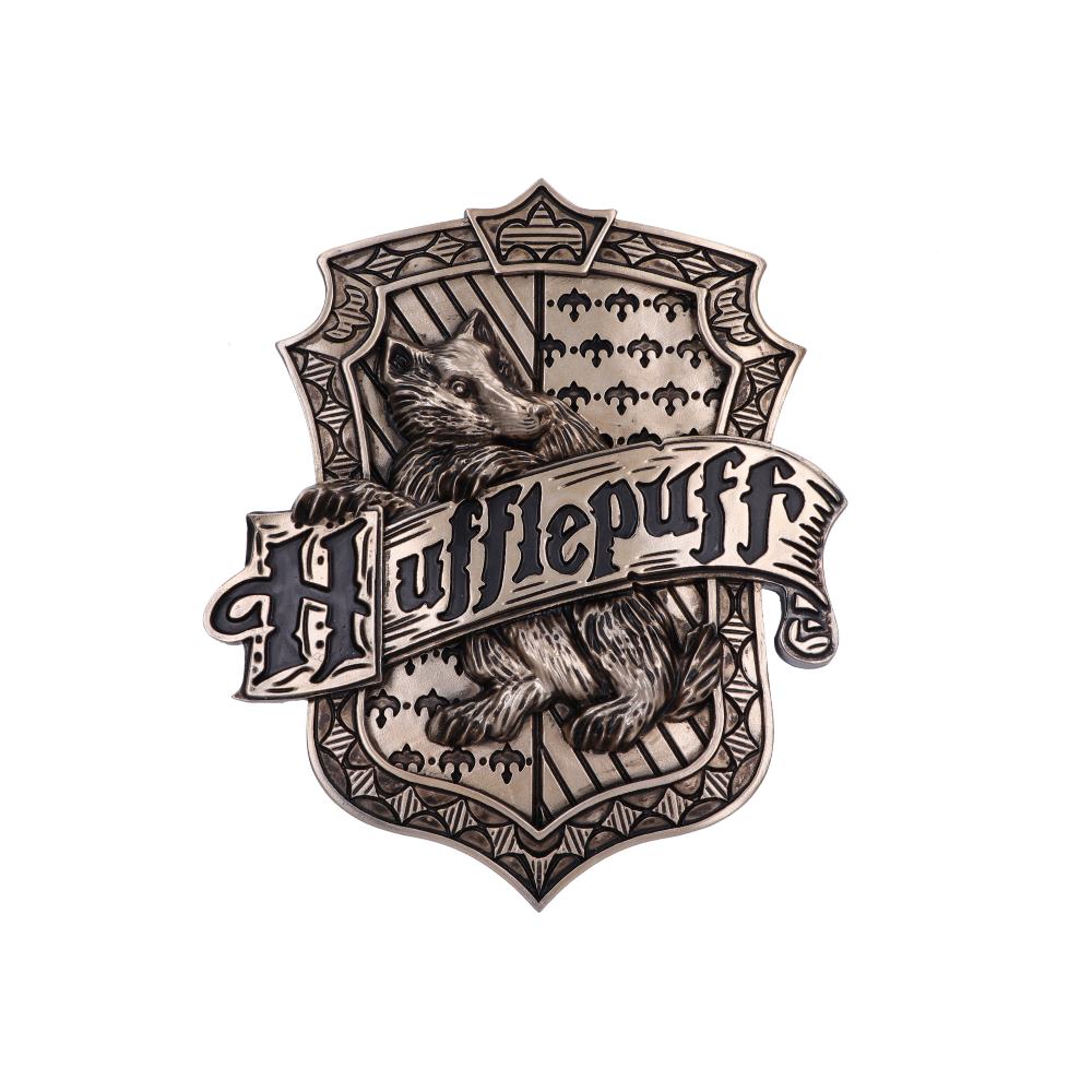 A shield-shaped emblem, depicting a badger standing within a patterned crest, displays the text "Hufflepuff" in bold, gothic lettering. The design features intricate, metallic detailing.