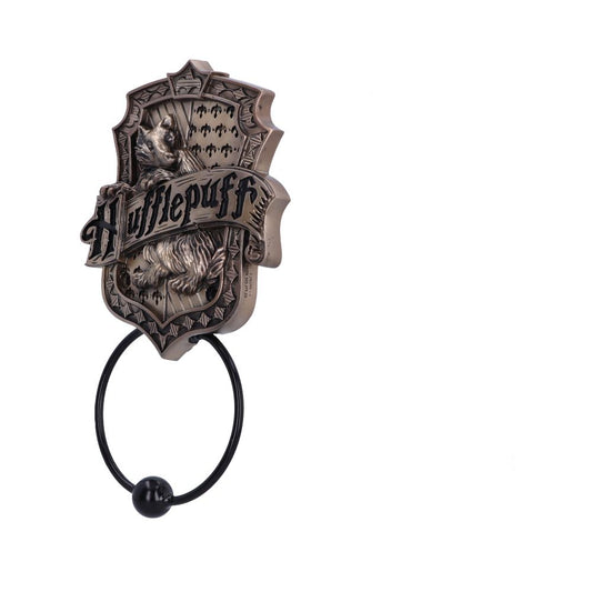 Bronze-colored door knocker features a badger emblem with "Hufflepuff" written across it. The knocker is ring-shaped, with ornate detailing, symbolizing a Harry Potter house in a minimalist setting.