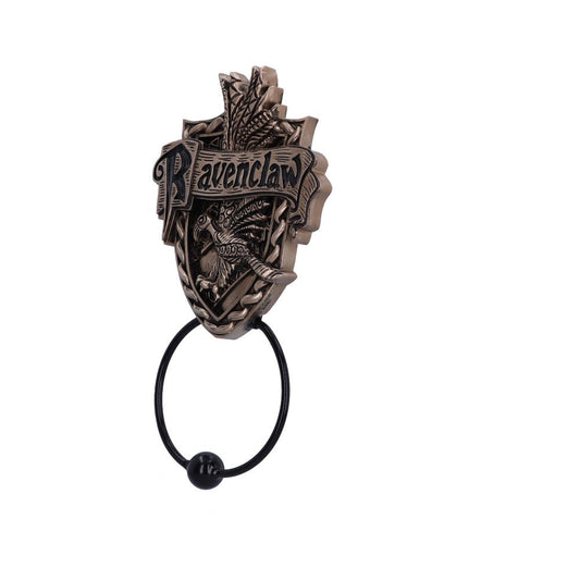 An ornate bronze-colored door knocker displays the word "Ravenclaw" with an eagle motif. It features an intricate shield design and a round knocker ring with a black end, set against a plain white background.