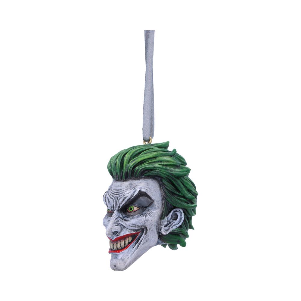 A detailed, grinning head ornament with vibrant green hair and exaggerated features hangs from a gray string against a plain white background.