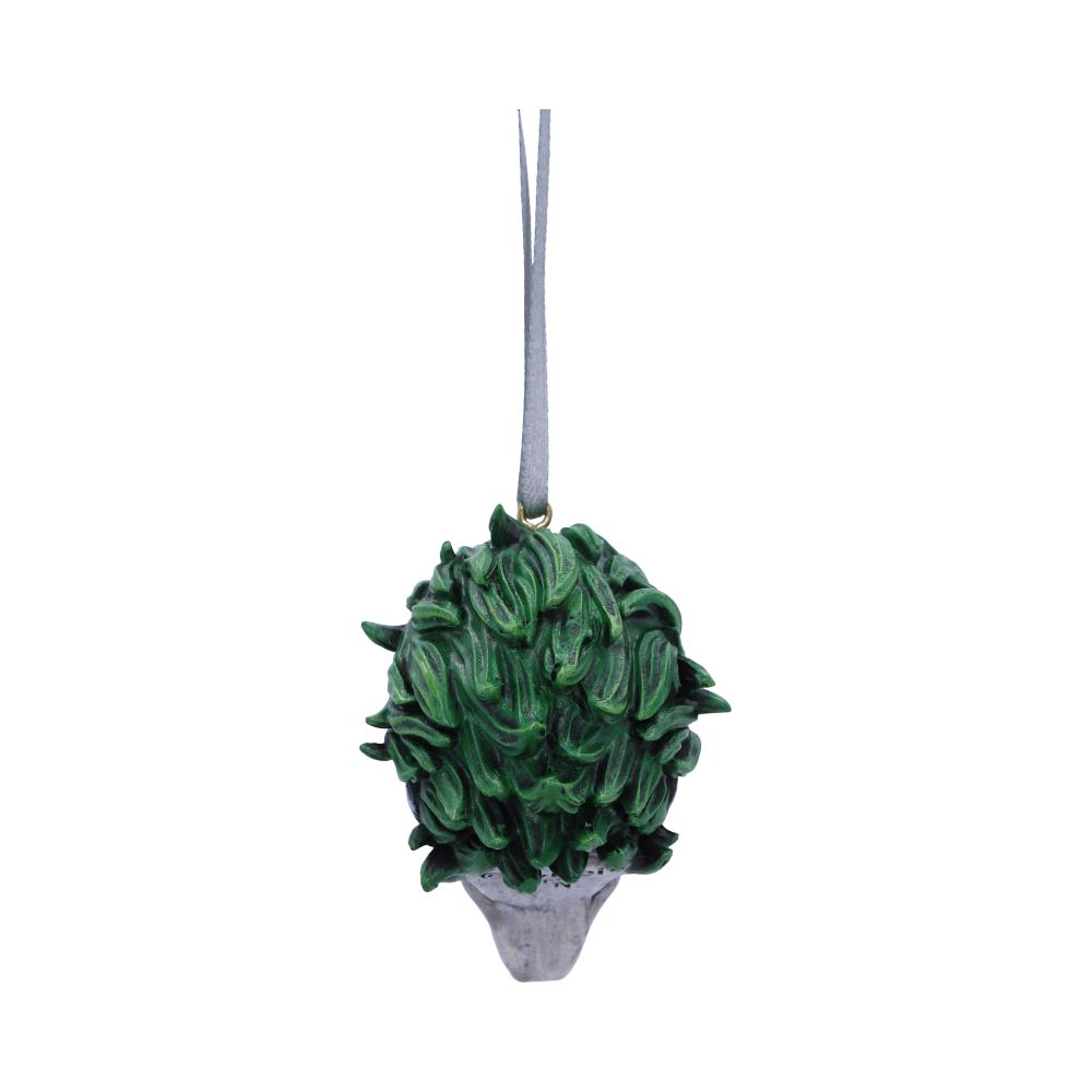 A decorative ornament with green leaf-like textures forms a topiary shape, suspended by a thin gray ribbon against a plain white background.