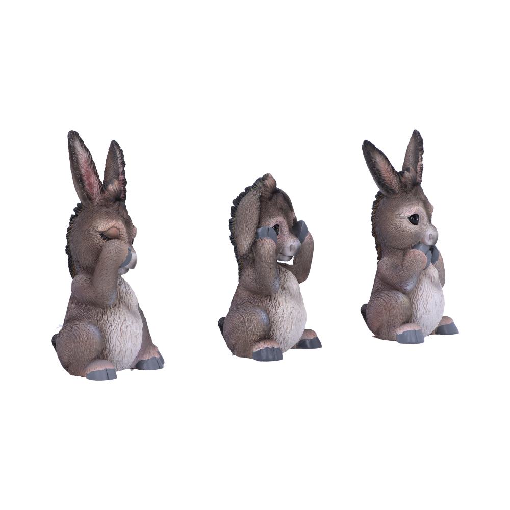 Three gray donkey figurines sit side-by-side, each with a different pose: covering eyes, covering ears, and covering mouth against a white background.
