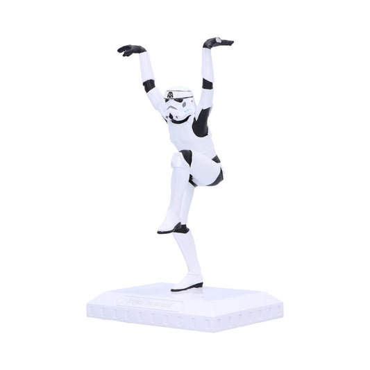 A white-armored Stormtrooper figurine balances on one leg with arms raised, set on a square display stand. The base reads "Trooper on Parade."