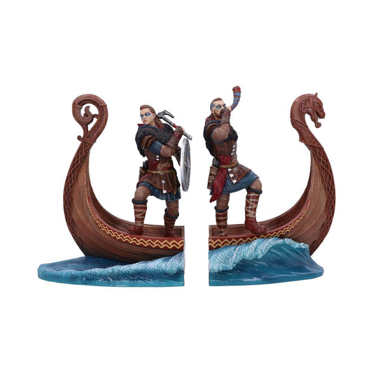 Two Viking figurines on separate longboat halves; one holds an axe and shield, the other sounds a horn. The boats rest on wavy blue water, suggesting a sea voyage.