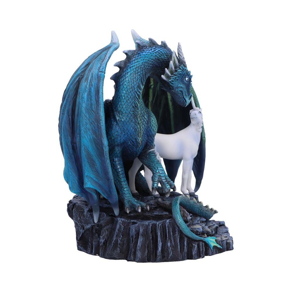 A blue dragon stands protectively over a small unicorn, positioned on a rocky platform. A baby dragon playfully crawls nearby, creating a mystical fantasy scene.