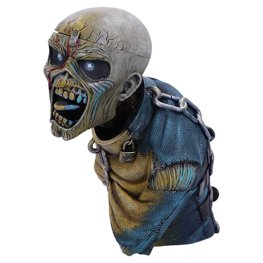 A grotesque, skeletal bust with cracked skin and glowing eyes screams, clad in tattered blue and yellow attire, adorned with chains and locks, set against a plain backdrop.