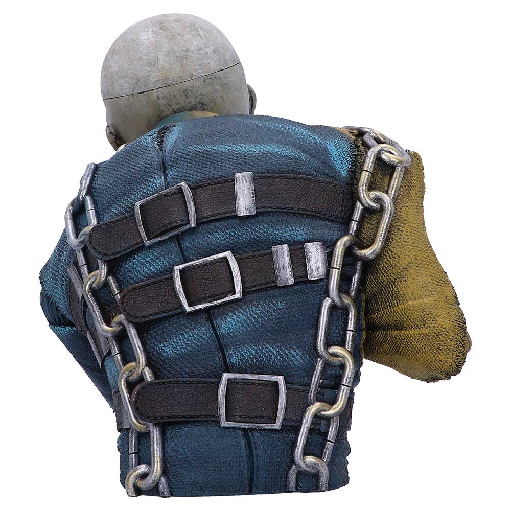 A sculpted figure from behind, with a bald head, wears a blue jacket with black straps and chains. One sleeve is yellow, contrasting the worn, rough-textured appearance of the piece.