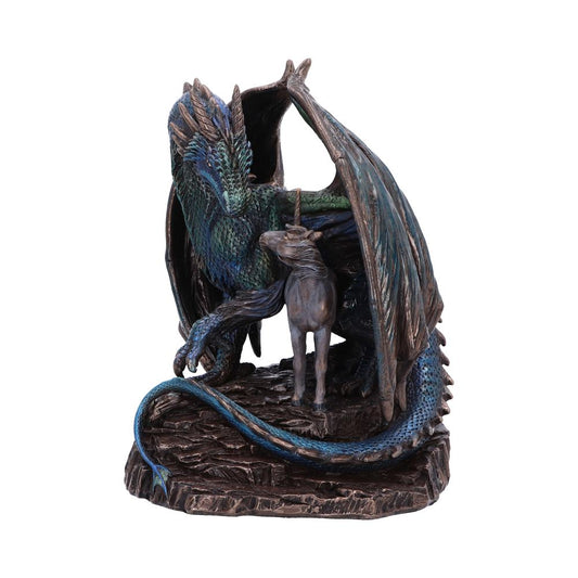 A detailed sculpture depicts a blue-green dragon embracing a unicorn. The dragon's wings form a protective canopy, set on a rocky base, conveying a mystical, protective scene.