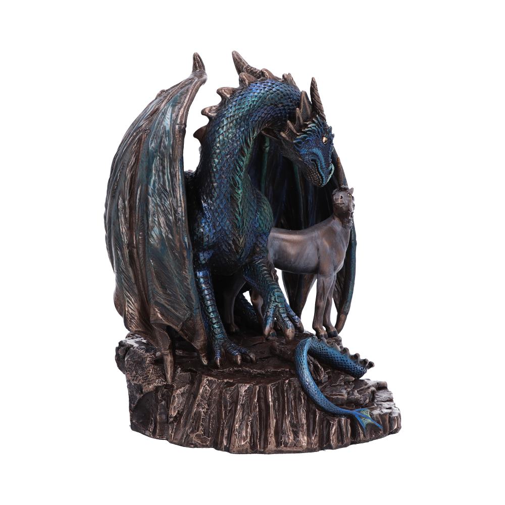 A detailed sculpture depicts a majestic dragon protectively curling around a unicorn. The dragon has intricate blue scales, while the unicorn stands gracefully on a rocky base, creating a mythical scene.