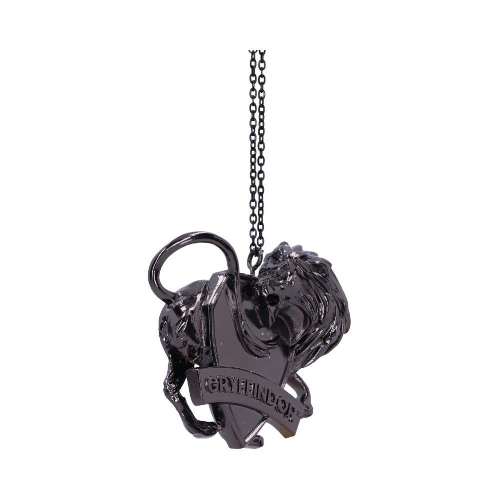A black lion pendant is attached to a thin chain, with a shield featuring the text "GRYFFINDOR" beneath it. The background is plain white, emphasizing the pendant's details.